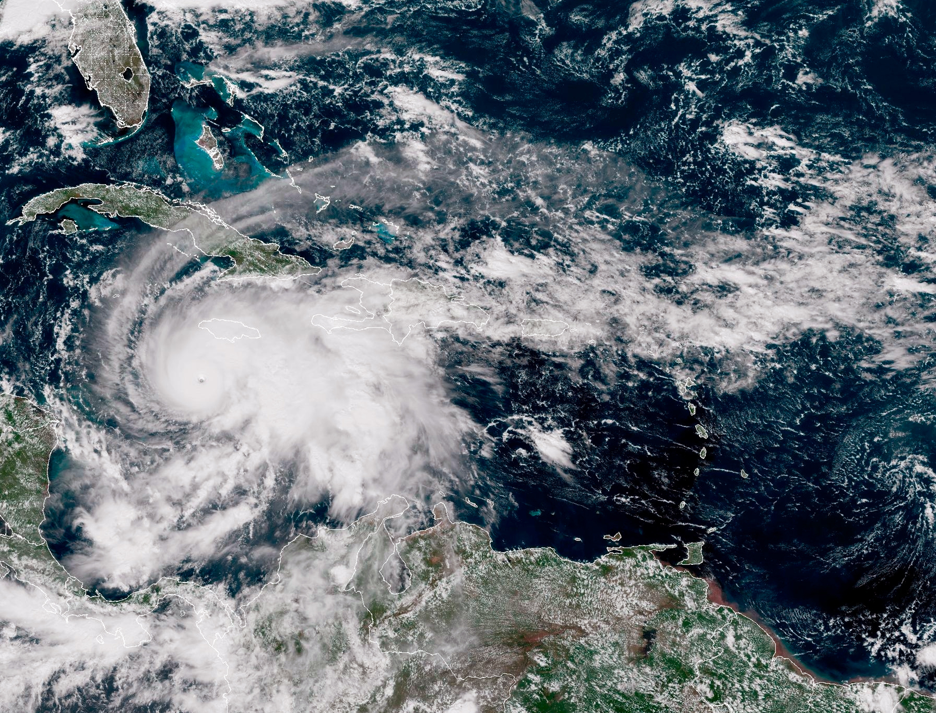In this handout satellite image provided by the National Oceanic and Atmospheric Administration (NOAA), Hurricane Melissa churns northwest through the Caribbean Sea captured on Oct. 27.